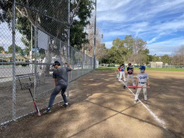 Coach Jonathan Valdez giving a private group lesson